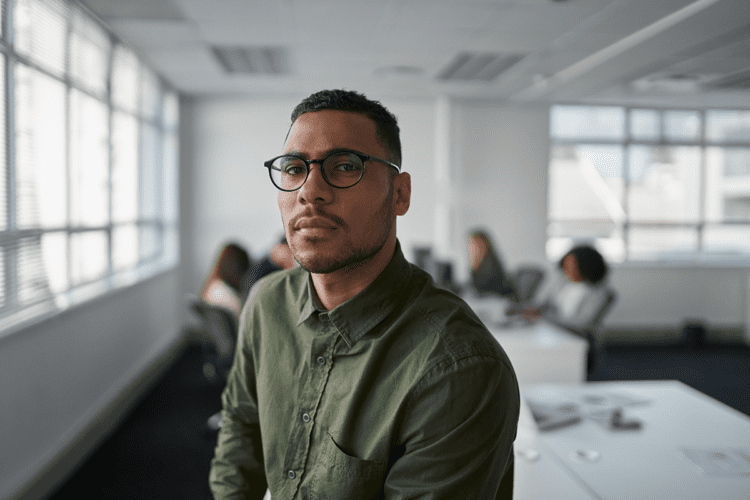 portrait of a man at work behind him