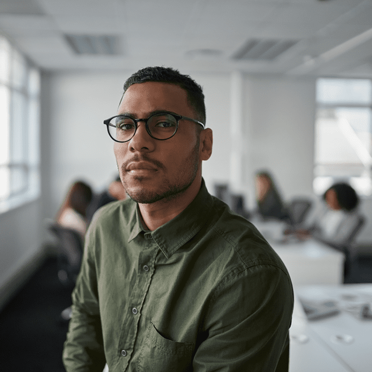 portrait of a man at work behind him